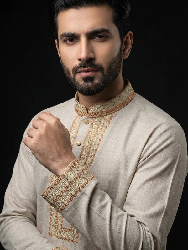 traditional embroidered Panjabi against a black background